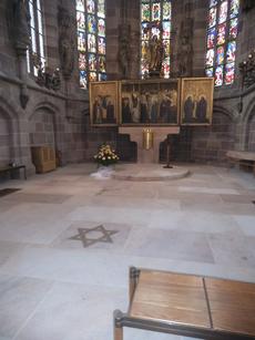 The Star of David on the "bimah" of the Frauenkirche church in the central market square of Nuremberg.