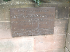 The plaque in Nuremberg which says: In Memory of Leo Katzenberger, President of the Nuremberg Jewish Community who was arrested and charged under the Nuremberg Laws in a trial of the Special Court, found guilty, and made a victim of Nazi Racial Justice