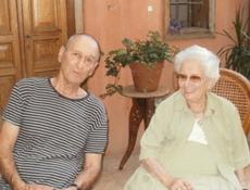 Ruth Dayan with her son Udi Dayan in the courtyard of a a stately Arabesque home in Jaffa